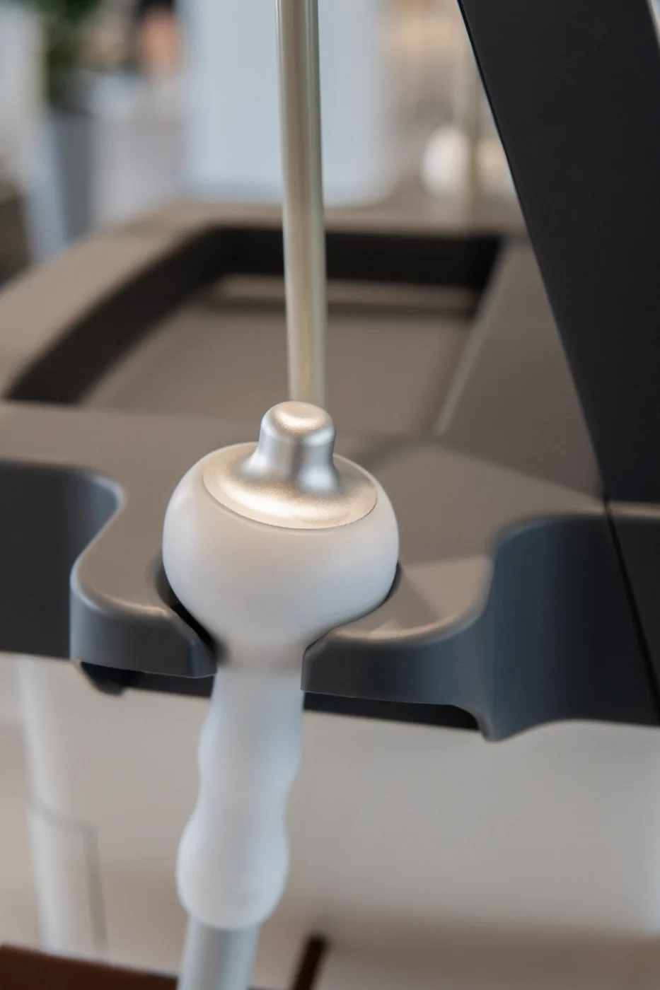 Anthéa handpieces resting in their cradles on the console